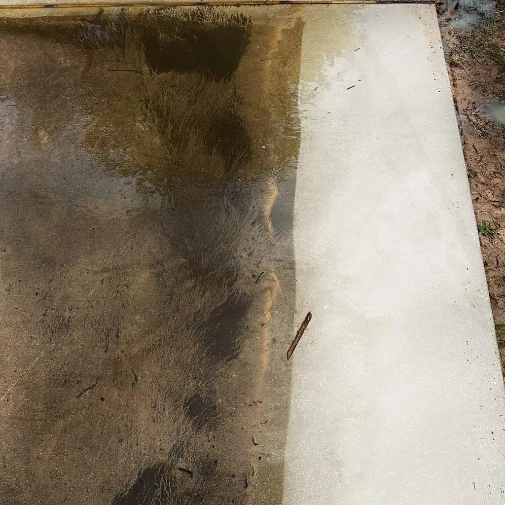 Dirty concrete with half pressure washed on the right and dirty on the left in West Perth